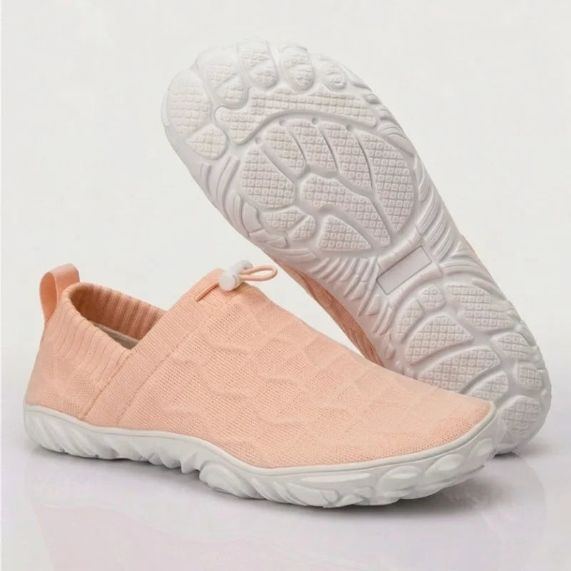 Glidevo Slipper in Rosa mit weißer Sohle, Seitenansicht und Sohlenprofil