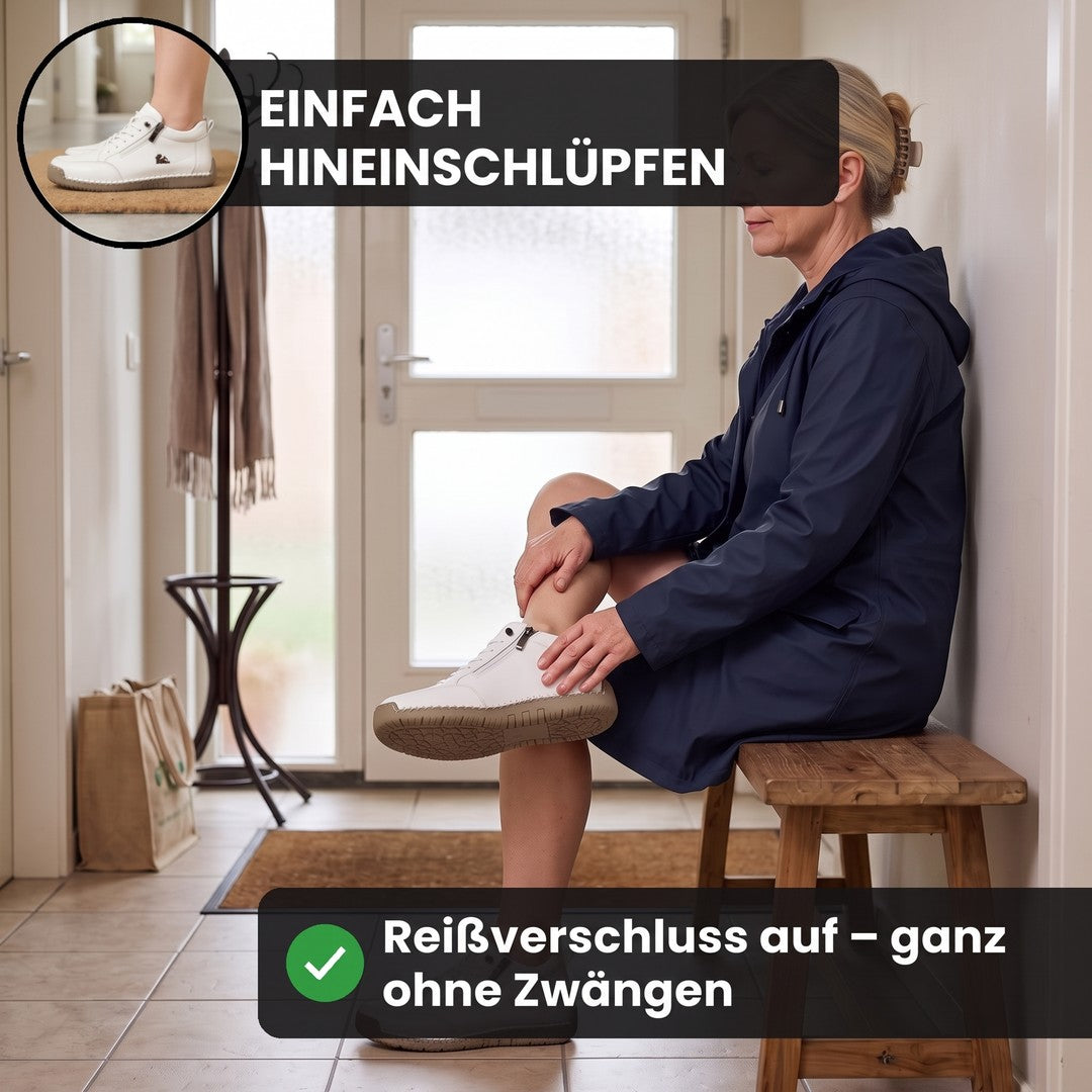 Frau zieht im Flur den weißen MayFit Zip an