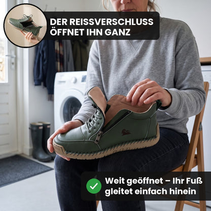 Frau hält den olivgrünen MayFit Zip mit ganz geöffnetem Reißverschluss