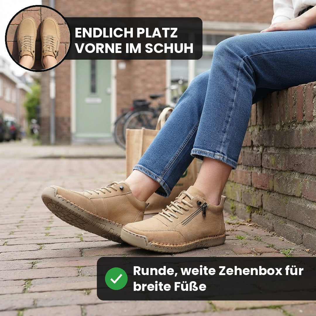 Beigefarbene MayFit Zip auf einer Mauer, von vorne gesehen