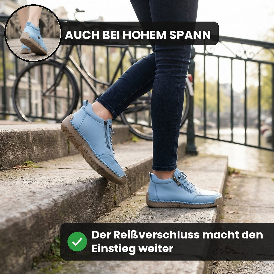 Frau steigt mit hellblauen MayFit Zip eine Treppe hinauf